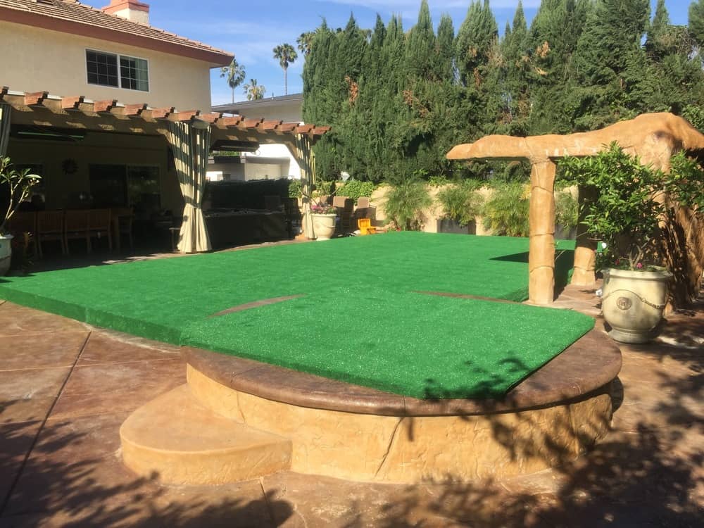 pool cover dance floor with green carpet turf