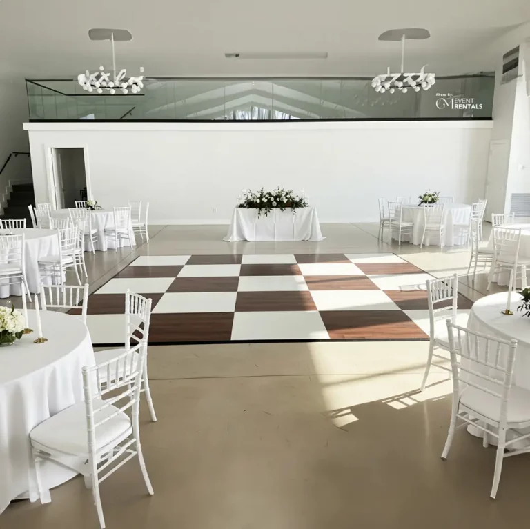 dark wood and white dance floor setup for wedding event