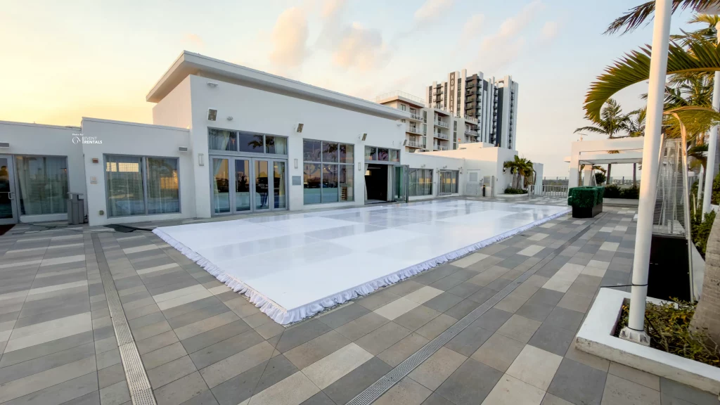 Rooftop white pool cover dance floor installation in Fort Lauderdale